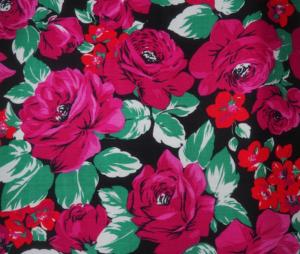 Un fin tissu ancien  ou vintage à motifs de roses