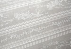 Jolie toile à matelas ancienne , motifs de fleurs , coloris lin fané